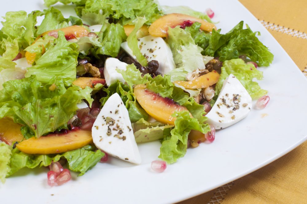 Salad with stone fruits and soft cheese